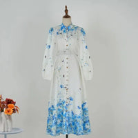Amelie - Top floral azul de cuello alto